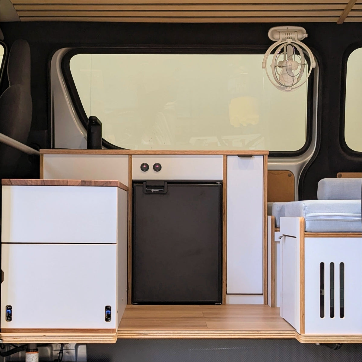HiAce H200 fit-out showing Bushman 50L upright fridge integrated into the kitchen cabinetry