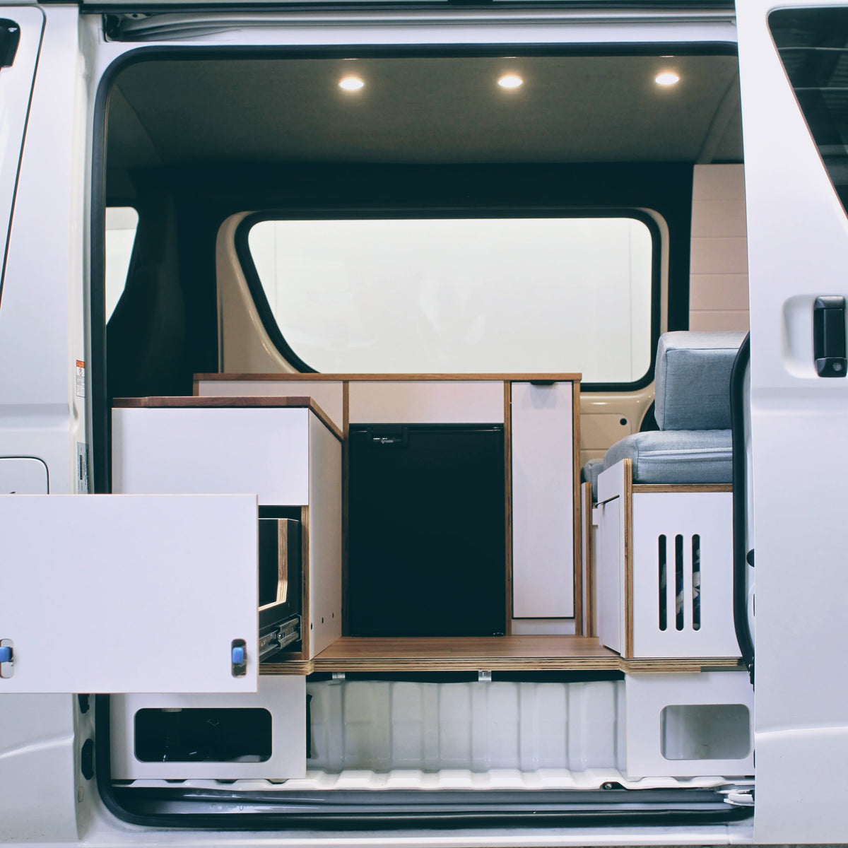 HiAce H200 campervan fit-out viewed through the sliding door